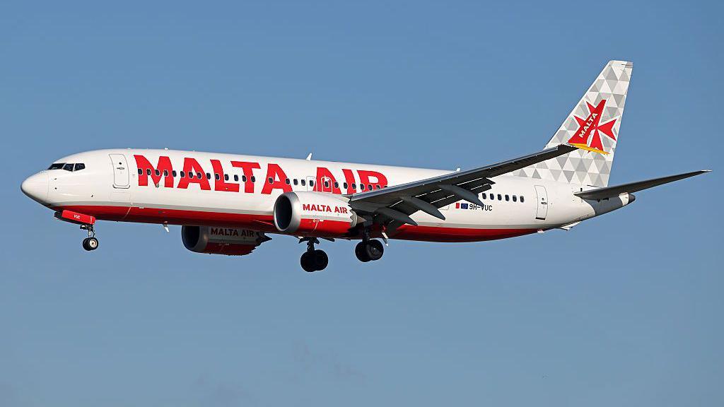 Passenger Nearly Suctioned Out of Airplane Window in Mid‑Flight Incident