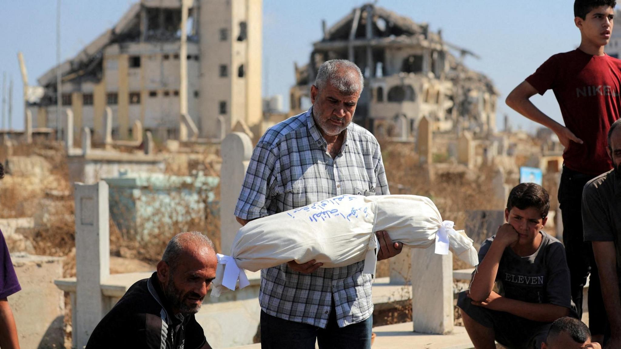 Israeli strikes in Gaza kill 12 Palestinians, including a family of six