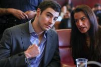 Luigi Mangione's pretrial hearing reveals critical evidence, including a loaded gun magazine and notes hinting at a motive, as defense lawyers attempt to exclude this evidence from his murder trial.