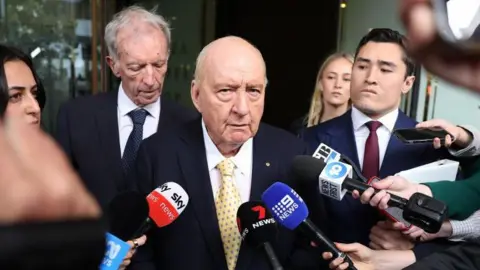 Charges Against Australian Radio Veteran Alan Jones Downgraded Amid Controversy