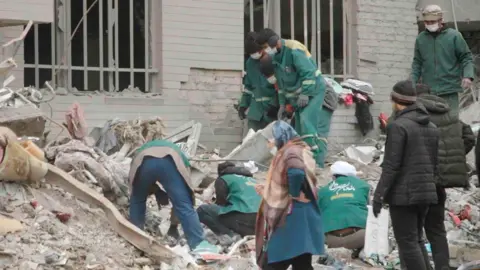 Civilians Suffer as Strikes Devastate Tehran: A Mother's Plea Amidst the Rubble